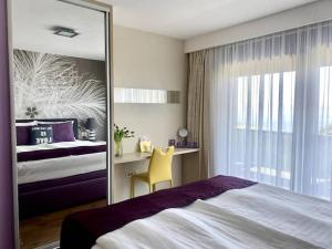 a bedroom with a mirror and a bed and a desk at Villa Ribica in Veliko Brdo +26 photos