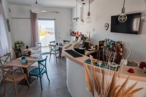 a bar in a restaurant with tables and chairs at Villa Aries - Rural Chic Experience in Gela +21 photos