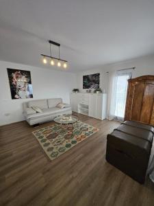 a living room with a couch and a table at Bella Vista in Stažnjevci