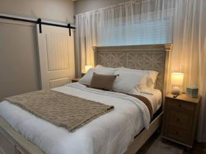 a bedroom with a large bed and a window at Beach House with Breathtaking Sunsets - Perfect for Couples and Families! in Bolivar Peninsula +44 photos