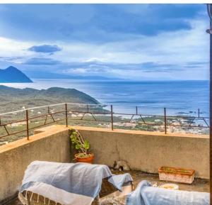 a balcony with a view of the ocean at Villa Emmanuella in Centuri