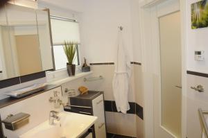 a bathroom with a sink and a mirror at Pension Dietrich in Dobel