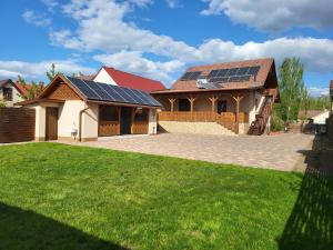 a house with solar panels on the roof at Li-Vi Apartman Debrecen in Debrecen
