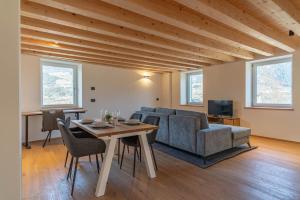 a living room with a couch and a table at Duplex Cermis in Cavalese