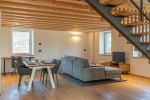 a living room with a table and a couch at Duplex Cermis in Cavalese