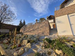a house with a stone staircase next to a building at Bella Vista in Stažnjevci