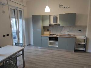 a kitchen with a sink and a counter top at Siderno A1passo in Siderno Marina