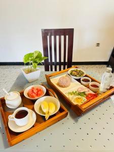 a table with a tray of food on a table at Yala Dream Wild Resort in Tissamaharama