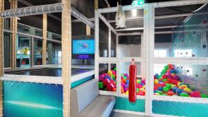 a poolarium with a bunch of balls in it at Rent A Holiday Home In Fun Art Fun In Blokhus! in Pandrup