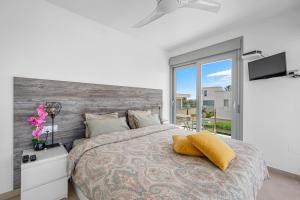 a bedroom with a large bed and a large window at 3110 Villa Malibu in Vistabella