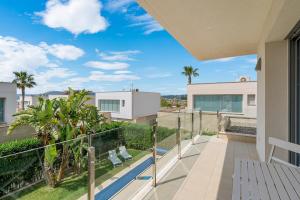 a balcony with a view of a building at 3110 Villa Malibu in Vistabella