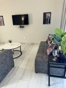 a living room with a couch and a table at Elephant's Crest Lodge in Victoria Falls