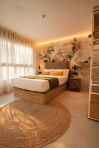 a bedroom with a bed and a large window at DozZze Julieta in Alicante