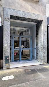 a large glass door of a building at Studio cosy à deux pas de Paris in Clichy