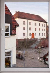 a large white building with a red roof at Walldürn Zentrum 2 in Walldürn