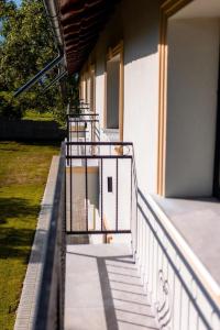a balcony with stairs on the side of a building at CHR Vista in Nicoreşti