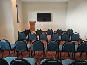 a conference room with chairs and a flat screen tv at Barida Hotels Davraz in Cobanisa +50 photos