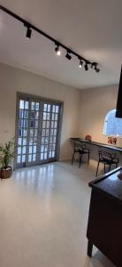 a large room with a table and chairs in it at Vieira's Residencial in Embu