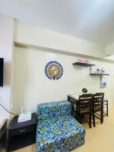 a living room with a couch and a table at Avida towers davao condo 6thfloor in Davao City