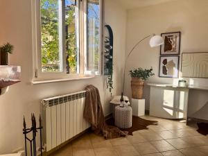 a room with a radiator and a window at Dimora dei Passi Lenti in Montegranaro +66 photos
