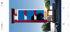 a rendering of a building with blue and red at Balaji Inn in Vellore