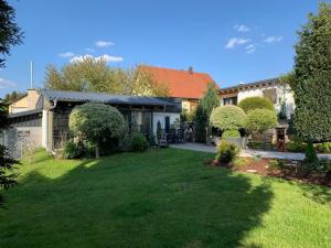 a house with a yard in front of it at Ferienanlage Klotz in Pleystein +20 photos