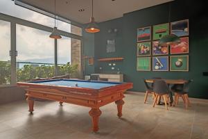 a room with a pool table and a dining room at Luxury Studio El Poblado Pool Rooftop 4th Floor in Medellín