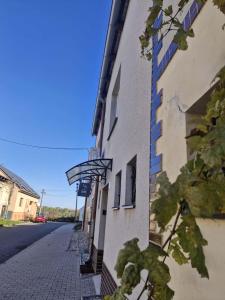 a building with a fire escape on the side of it at Sklípek u Štýblů in Velké Němčice