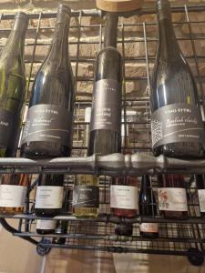 a bunch of wine bottles on a rack at Sklípek u Štýblů in Velké Němčice
