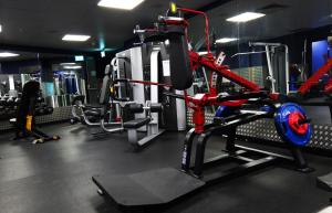 a gym with lots of equipment in it at Camden Court Hotel in Dublin