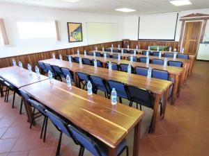 a row of tables and chairs in a classroom at Ngandu at Sea in Meersig