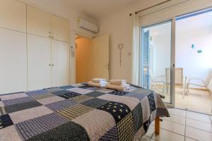 a bedroom with a bed with two towels on it at Resitour - Tala Hills in Tala