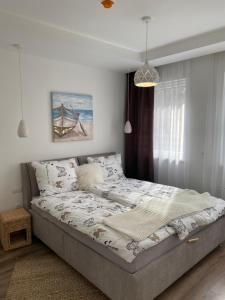 a bedroom with a bed in a room at Ady13 Vendégház Eger in Eger +22 photos
