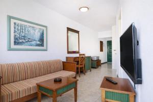 a living room with a couch and a table at Las Faluas by Youroom in Playa del Ingles
