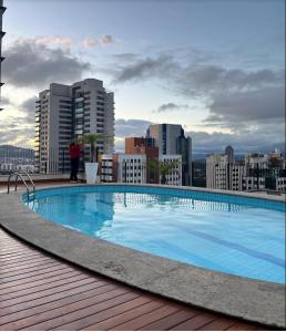 a large swimming pool on the roof of a building at Hotel Sol Alphaville in Barueri
