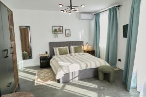 a bedroom with a bed and a ceiling fan at Gatev House in Teteven