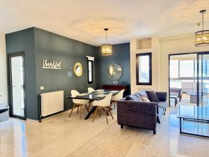 a living room with a couch and a table at Mountain View Ariz in Al Arz