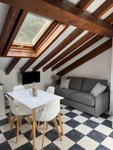 a living room with a table and a couch at Apartamentos Rurales Valverde in Potes