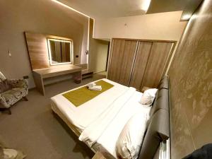 a bedroom with a large bed and a window at Rawsheh Boutique Hotel in Beirut +41 photos