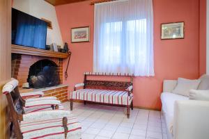 a living room with a couch and a fireplace at Villaina in Komiža