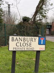 a sign for a barbury close private road at New 2-bed 2-bath detached flat with garden in Enfield