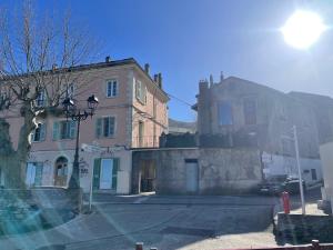an old building in a city with a street at Gite rustique de charme chez Santa é Pasquà in San-Martino-di-Lota +14 photos