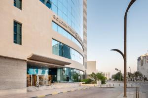 a rendering of the exterior of a building at Golden Tulip Doha Hotel in Doha