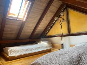 a room with two beds and a window at Vila Davidovic-Fruska gora in Manđelos
