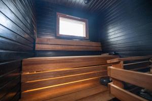 a small sauna with a window in the middle at Villa Luoto A Stylish semi-detached house Incl AC, Sauna, Terrace in Kalajoki
