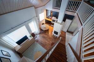 an overhead view of a living room and dining room at Villa Luoto A Stylish semi-detached house Incl AC, Sauna, Terrace in Kalajoki