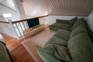 a living room with a couch and a table at Villa Luoto A Stylish semi-detached house Incl AC, Sauna, Terrace in Kalajoki +18 photos