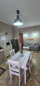 a living room with a white table and chairs at Stella Marina Bed and Breakfast sul mare in Realmonte