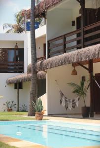 a view of the villas from the pool at Pousada Maresia in Guajiru