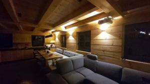 a living room with a couch and a table at Roubenka Panské Pole in Panské Pole
